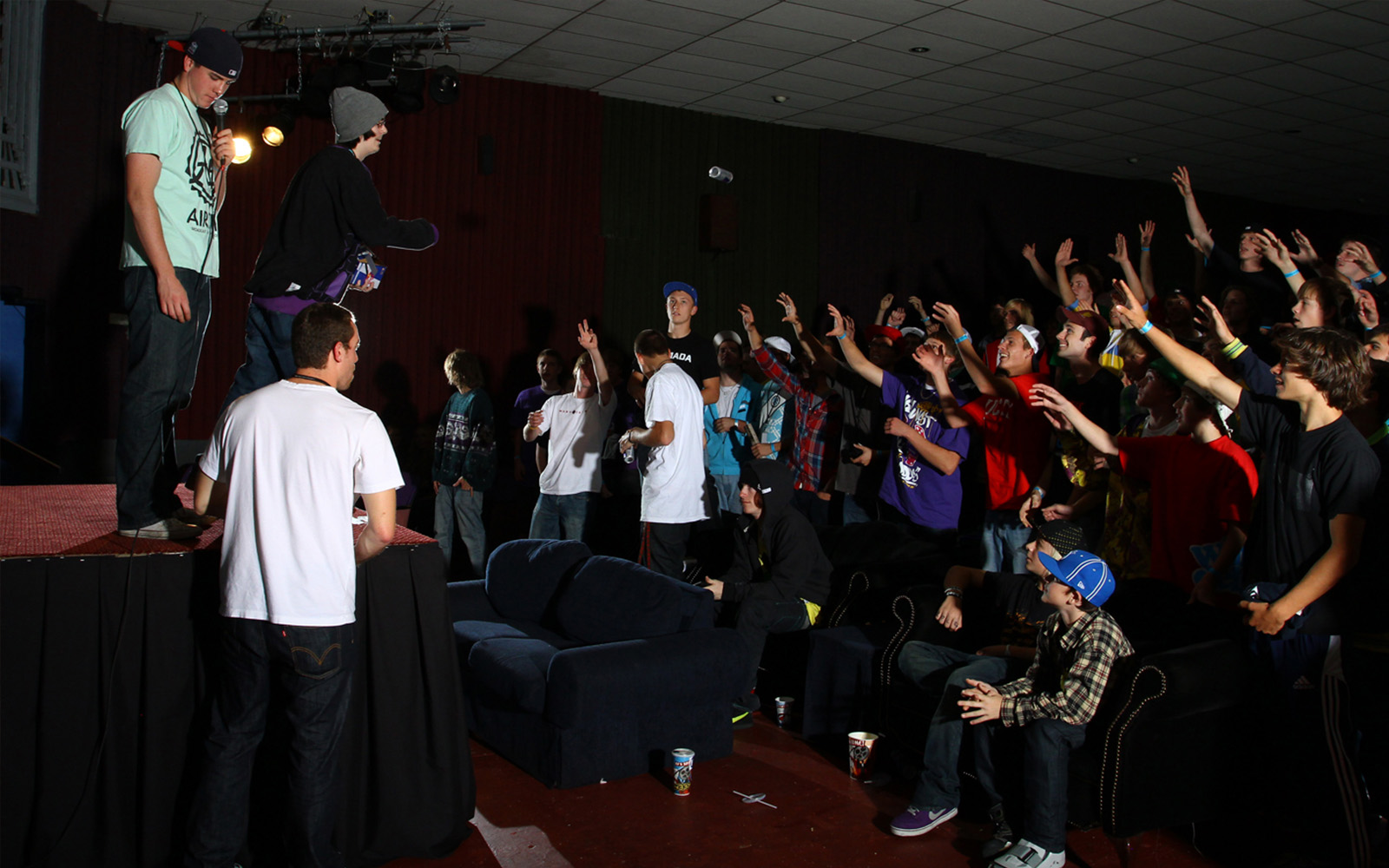 MWSFF crowd at the Times Cinema, hands raised toward the stage