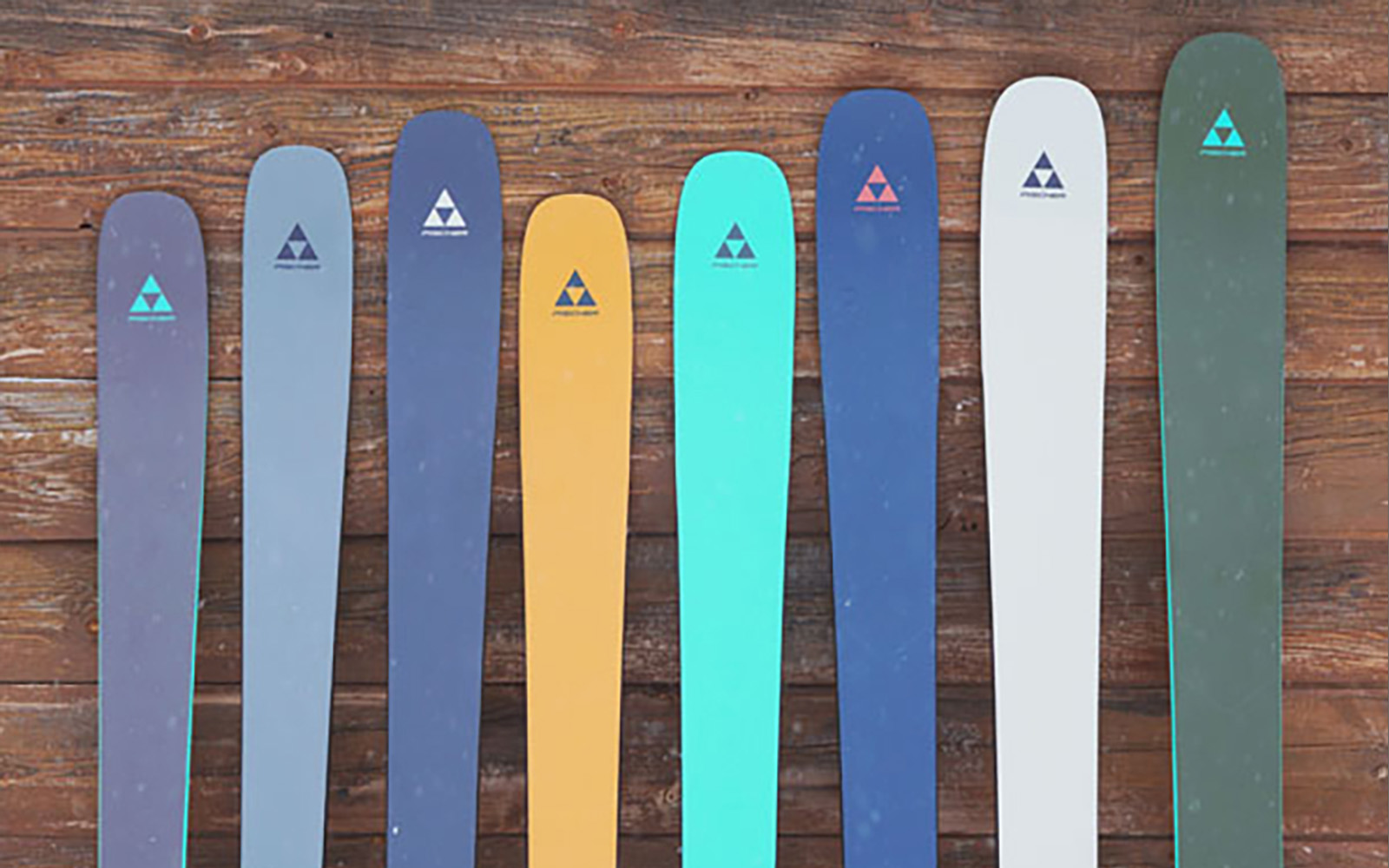 The Fischer Ranger lineup against a wood plank wall