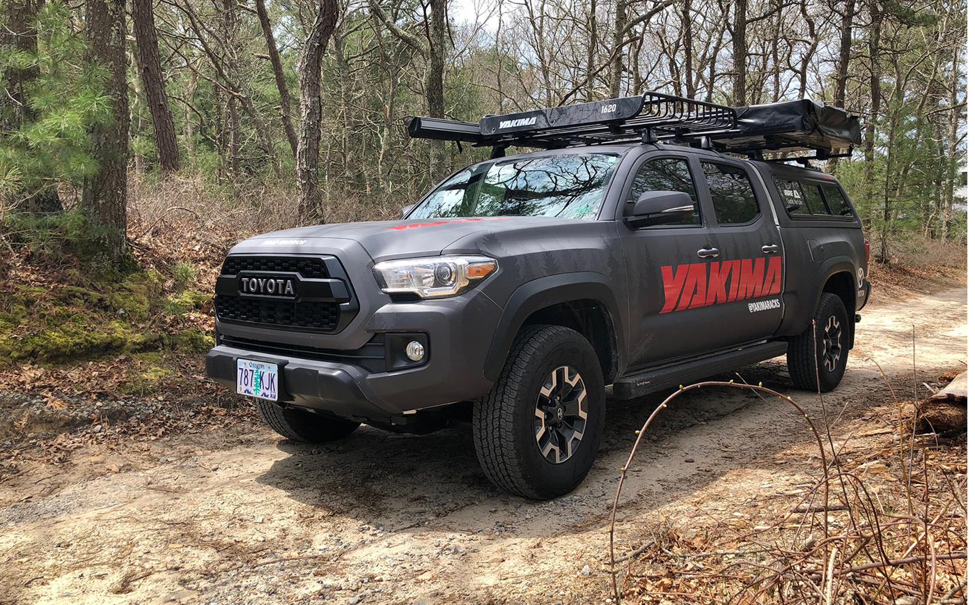 Yakima-branded Toyota Tacoma on a dirt trail